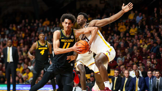 Nov 16, 2023; Minneapolis, Minnesota, USA; Missouri Tigers forward Trent Pierce (11) works around Minnesota Golden Gophers forward Pharrel Payne (21) during the second half at Williams Arena. Mandatory Credit: Matt Krohn-USA TODAY Sports